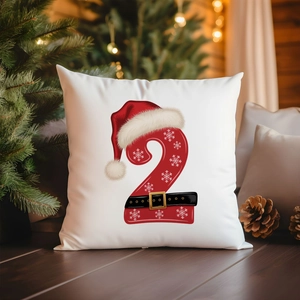 Detailed Christmas pillowcase featuring red number 2 and snowflakes on a white fabric