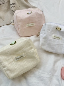 Floral makeup bags in pink, white and beige with lace trim and small rose accents