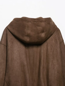 Detail of a brown suede hooded bomber jacket showing the textured fabric and stitching