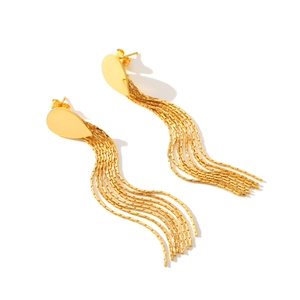 Detail view of golden tassel earrings with water drop studs and polished wavy chains