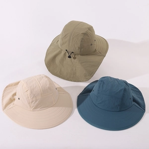 Detailed view of children's sun hats with neck flaps in green, beige and blue colors