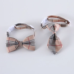 Detail of adjustable khaki plaid pet bowtie and necktie set with white buckle