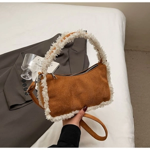 Brown frosted leather shoulder bag with white faux fur trim and adjustable strap