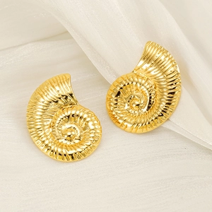 Chic 18K gold plated seashell earrings with textured spiral design on white silk background