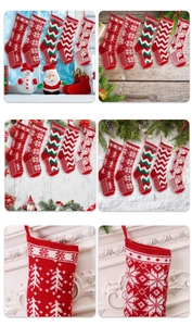 Close-up of knitted Christmas stockings with snowflake and reindeer embroidery patterns