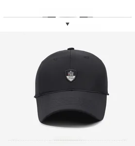 Detail of black winter baseball cap with ear flaps and shield crown logo embroidery