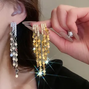Elegant silver pin zircon long tassel earrings with shimmering metal sequins in gold and silver