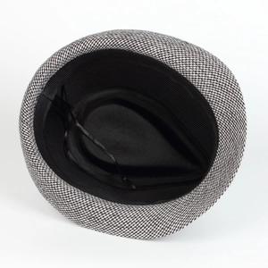 Close-up of black and white houndstooth wool hat with inner sweatband and drawstring
