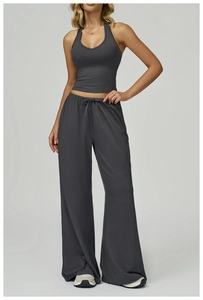 Detail of dark grey brushed yoga set featuring halter top and drawstring wide-leg pants