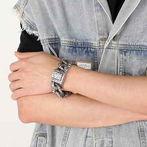 Detail of retro silver heavy chain bracelet with hammered texture square buckle for men