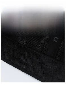 Detail of wide moisture-wicking sweatband and breathable mesh fabric on a black sports hat