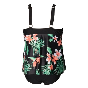 Close-up of tropical floral tankini with adjustable straps and ruffled hem design