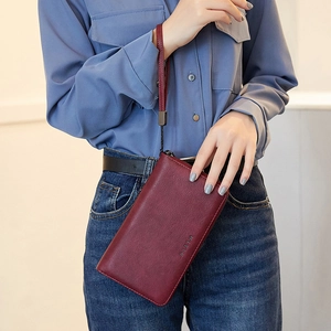 Vintage wine red RFID leather long wallet for women featuring a secure wrist strap