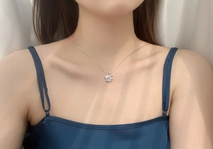Silver S925 windmill pendant necklace with sparkling moissanite on a model neck