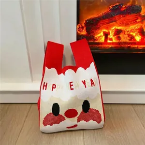 Christmas themed knitted tote bag with Santa Claus design and Happy New Year text