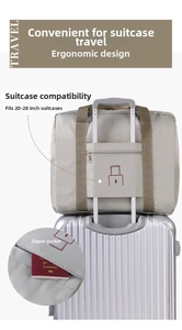 Detail of grey travel storage bag with suitcase sleeve and convenient back zip pocket