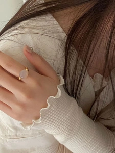 Elegant 925 silver ring with oval lilac gemstone worn on finger in a lifestyle setting