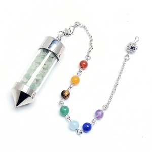 Detailed view of cone crystal wishing bottle pendant with chakra beads and green stones