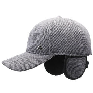 Winter thermal baseball cap with ear flaps in gray wool fabric and metal logo badge