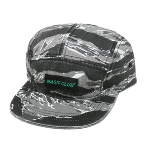 Detail of the durable tiger stripe camo canvas and woven logo on the 5-panel camper hat