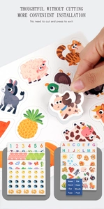 Detail of pre-cut animal stickers and alphabet learning pages in early education busy book