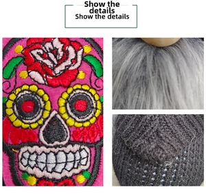 Detail showing sugar skull embroidery and faux fur texture on Halloween gnome decor