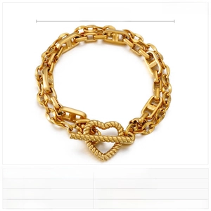 Detail of gold titanium steel double-layer chain bracelet with heart OT buckle design