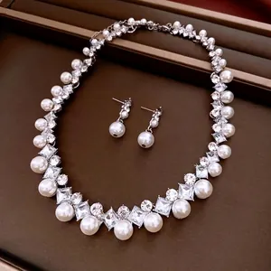 Elegant French vintage jewelry set featuring diamond-inlaid pearls and necklace