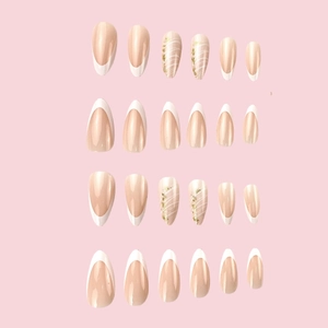 French tip press-on nails with white marble patterns and gold foil on long almond shape