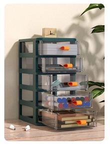 Close-up of a 5-tier dark green desktop organizer with transparent drawers on wood desk