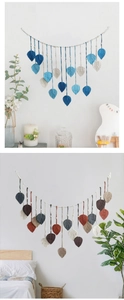 Detailed view of handmade macrame leaf wall hangings in blue and earthy color schemes