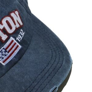 Close-up of vintage washed cotton cap with Boston 1932 embroidery and US flag detail