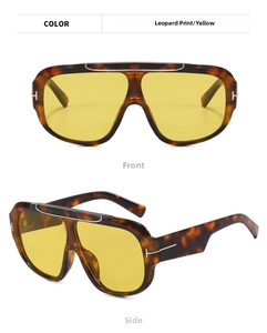 Detailed view of leopard print aviator sunglasses with signature T-shaped metal hinge accents