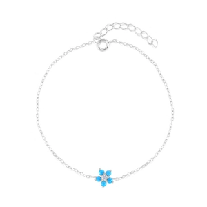 Elegant S925 sterling silver bracelet with blue flower charms and white crystals on white background