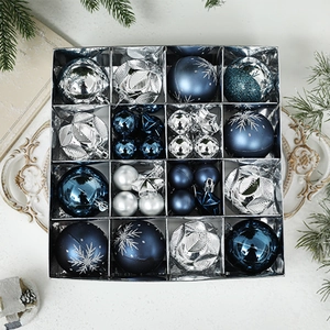 Blue and silver Christmas ornaments set with star and leaf shapes in a grid box