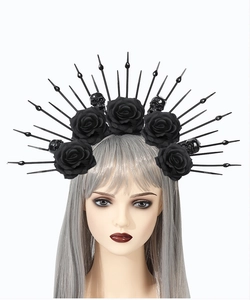 Detail of gothic sunburst halo crown with black roses, mini skulls and sharp spikes