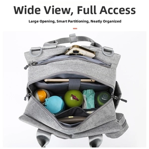Top view of large capacity gray diaper bag showing organized internal compartments