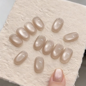 Short oval champagne pearl cat eye press-on nails with ice-through glass bead finish