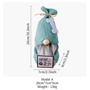 Detail showing knit gnome doll with dog bone hat and Home is Where the Dogs Are sign