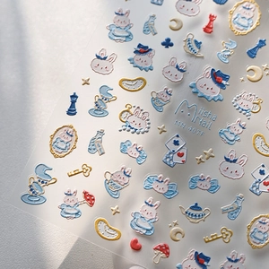 3D embossed nail art stickers with light blue Alice in Wonderland rabbit and gold accents