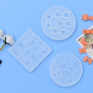 Bow heart candy silicone fondant molds set with orange resin finished samples