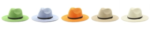 Flat lay of colorful straw sun hats with black PU leather bands and metal rivets