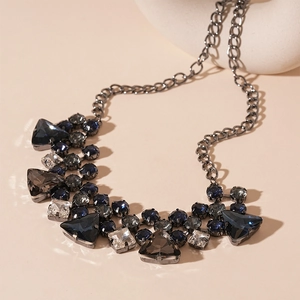 Statement geometric necklace with blue and grey crystals on gunmetal chain links