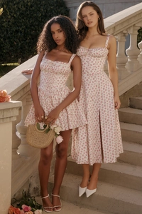 Detail showing the floral pattern, spaghetti straps and pleated bust of the summer dress