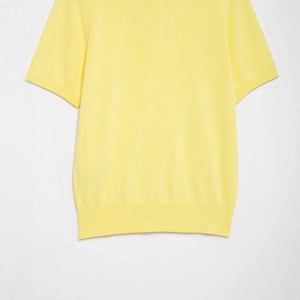 Bright yellow short-sleeve polo knit top with ribbed hem and high-quality cotton blend