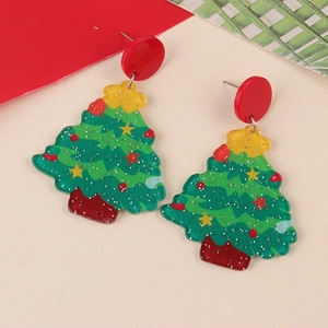 Detailed view of green glitter acrylic Christmas tree stud earrings with festive red accents