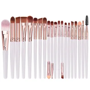 Detail view of 20-piece makeup brush set with white handles and rose gold ferrules
