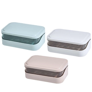 Double-layer drainage soap box in light blue, white, and beige colors on white background
