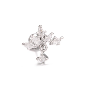 Macro shot of silver flower tragus stud with marquise cubic zirconia and dangle charm