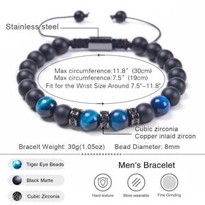 Adjustable men's beaded bracelet with tiger eye stone and black matte beads on white background